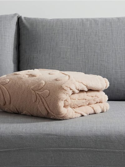 Coperta con motivo vegetale